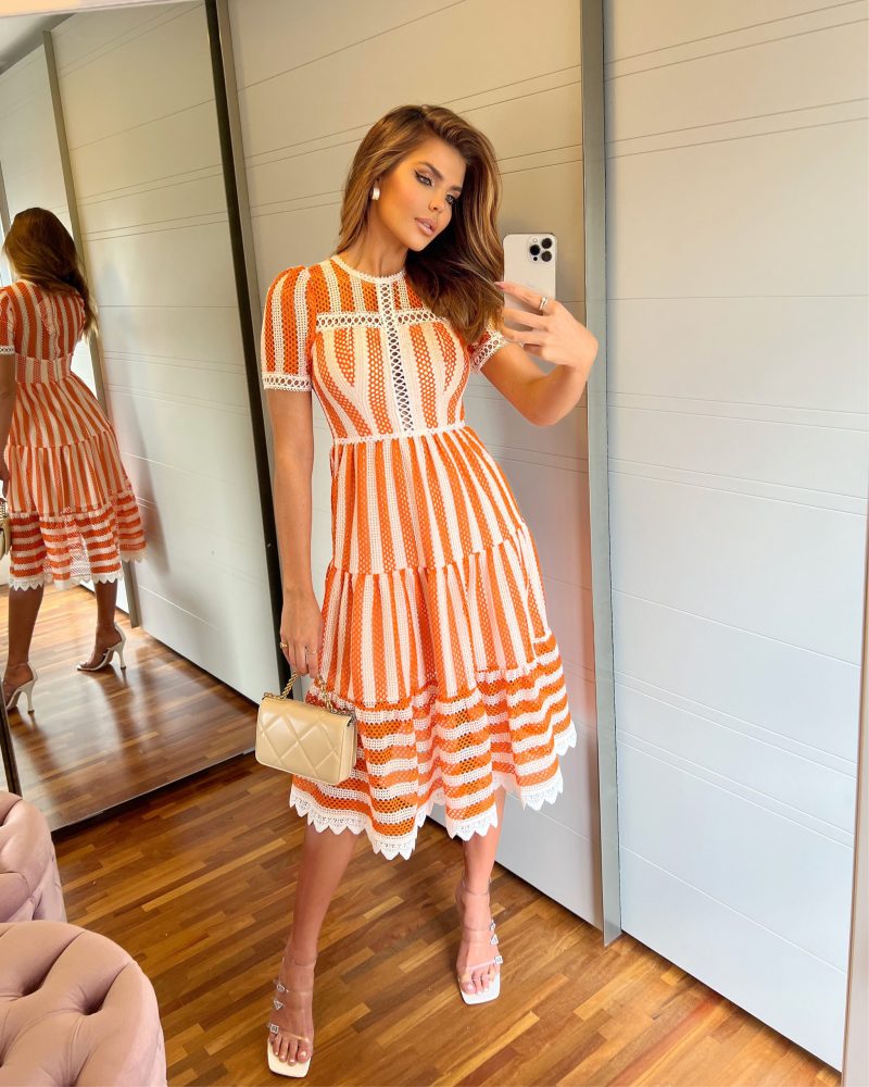 Elegant lace dress, orange and white striped pattern, intricate lace details, form-fitting top, flowing skirt